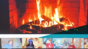 Screenshot eines Videocalls, bei dem groß ein Bild von einem Lagerfeuer zu sehen ist